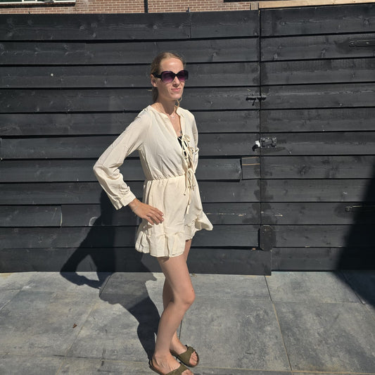 Zomerjurk met striksluiting en franjes